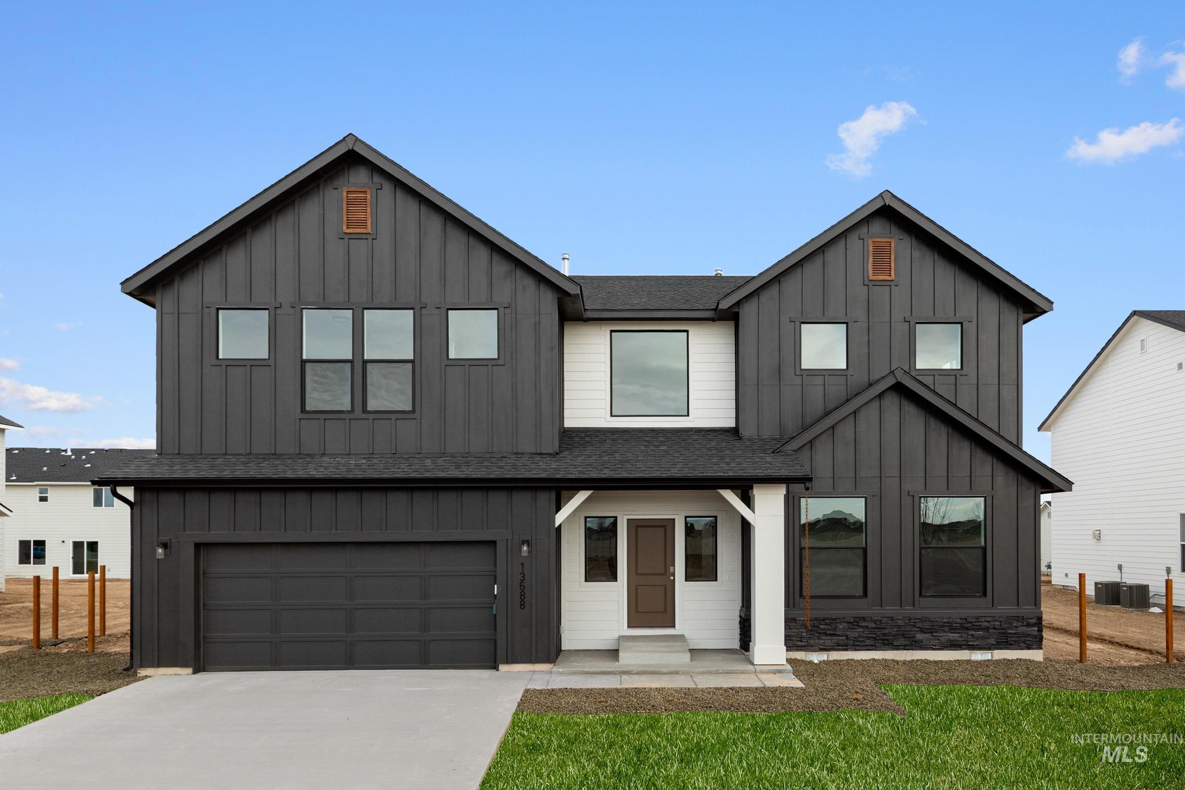 13688 Redway Court Caldwell, ID 83607 - Photo 1 of 26 Modern farmhouse style home with a shingled roof, board and batten siding, a garage, driveway, and a porch