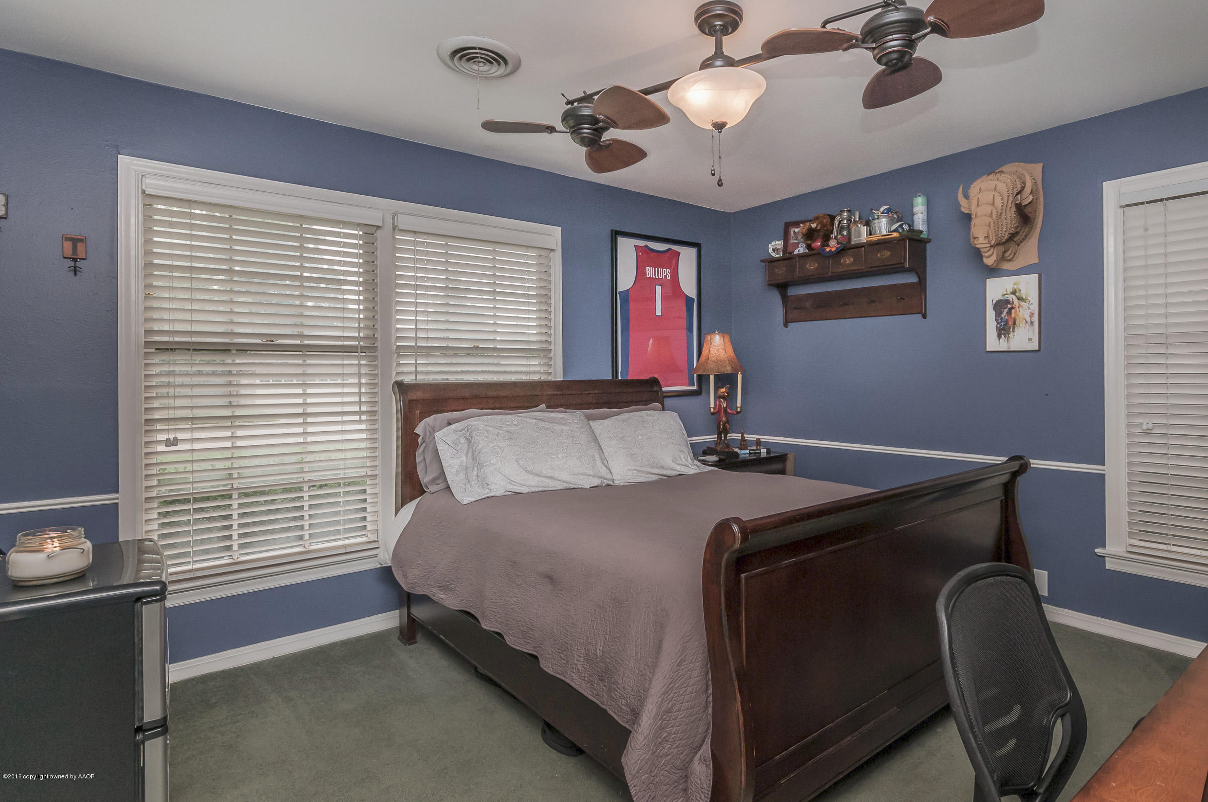6107 Calumet Road Amarillo, TX 79106 - Photo 24 of 29 a bed sitting in a bedroom next to a window
