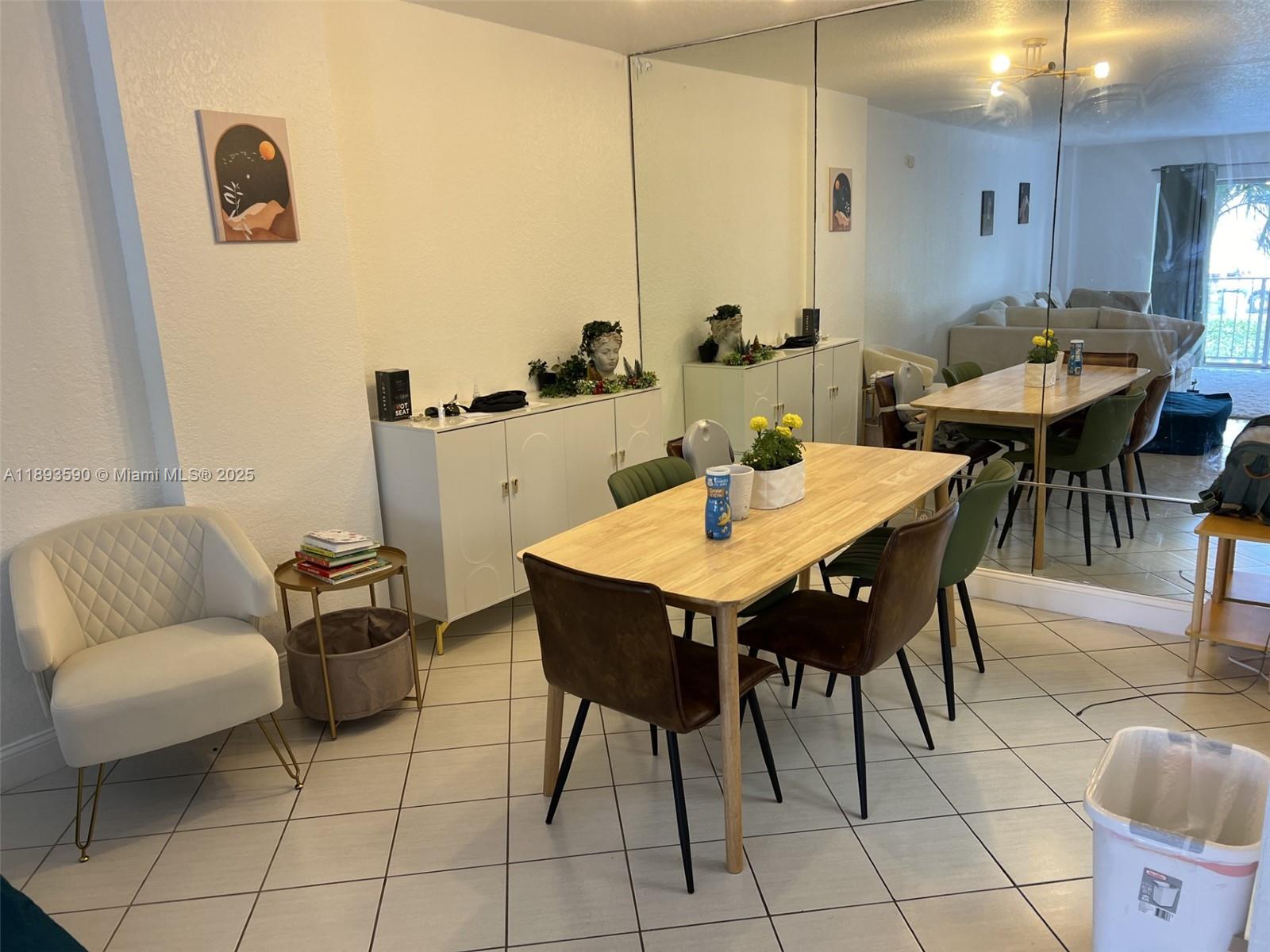 950 Ponce De Leon Road, Unit 2100 Boca Raton, FL 33432 - Photo 8 of 15 a view of a dining room with furniture