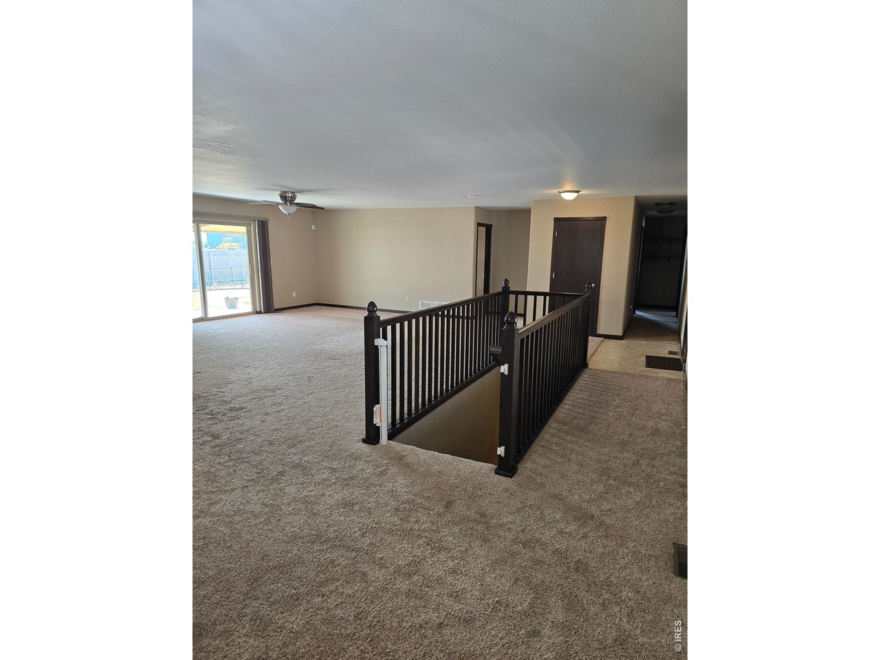 14846 Bluestem Street Sterling, CO 80751 - Photo 1 of 28 a view of a hallway with staircase