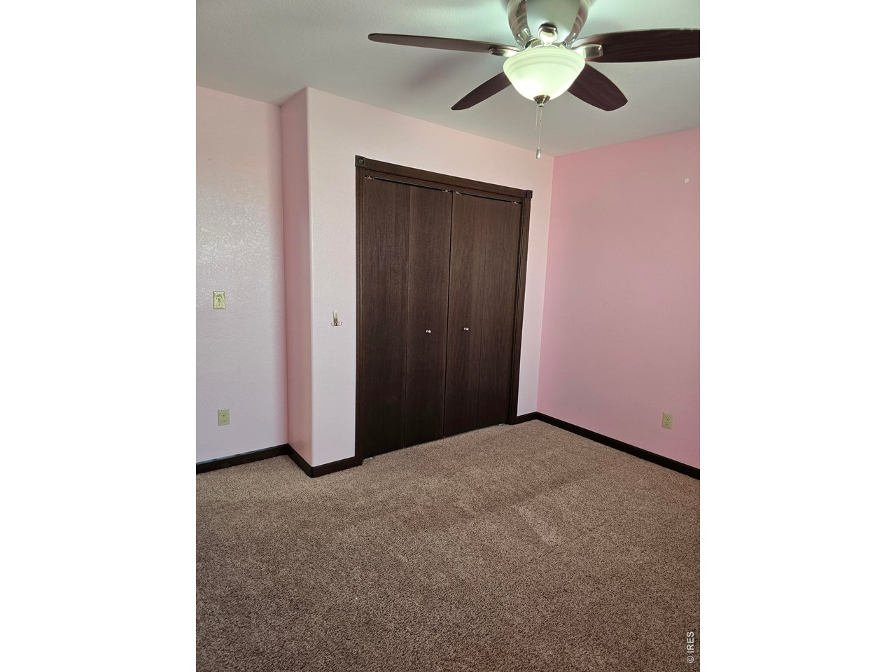 14846 Bluestem Street Sterling, CO 80751 - Photo 12 of 28 a view of an empty room with a window