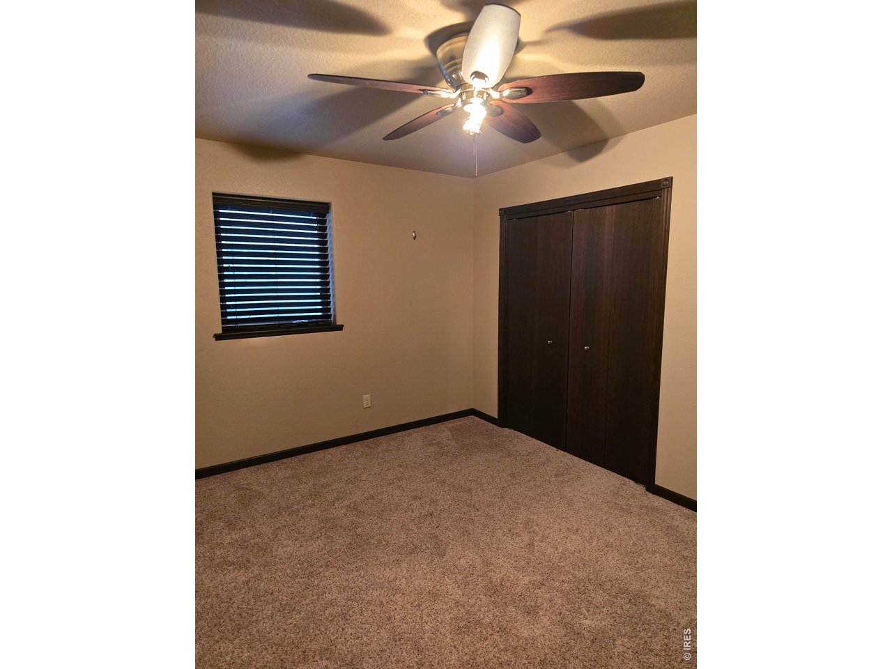 14846 Bluestem Street Sterling, CO 80751 - Photo 20 of 28 a view of an empty room with a window