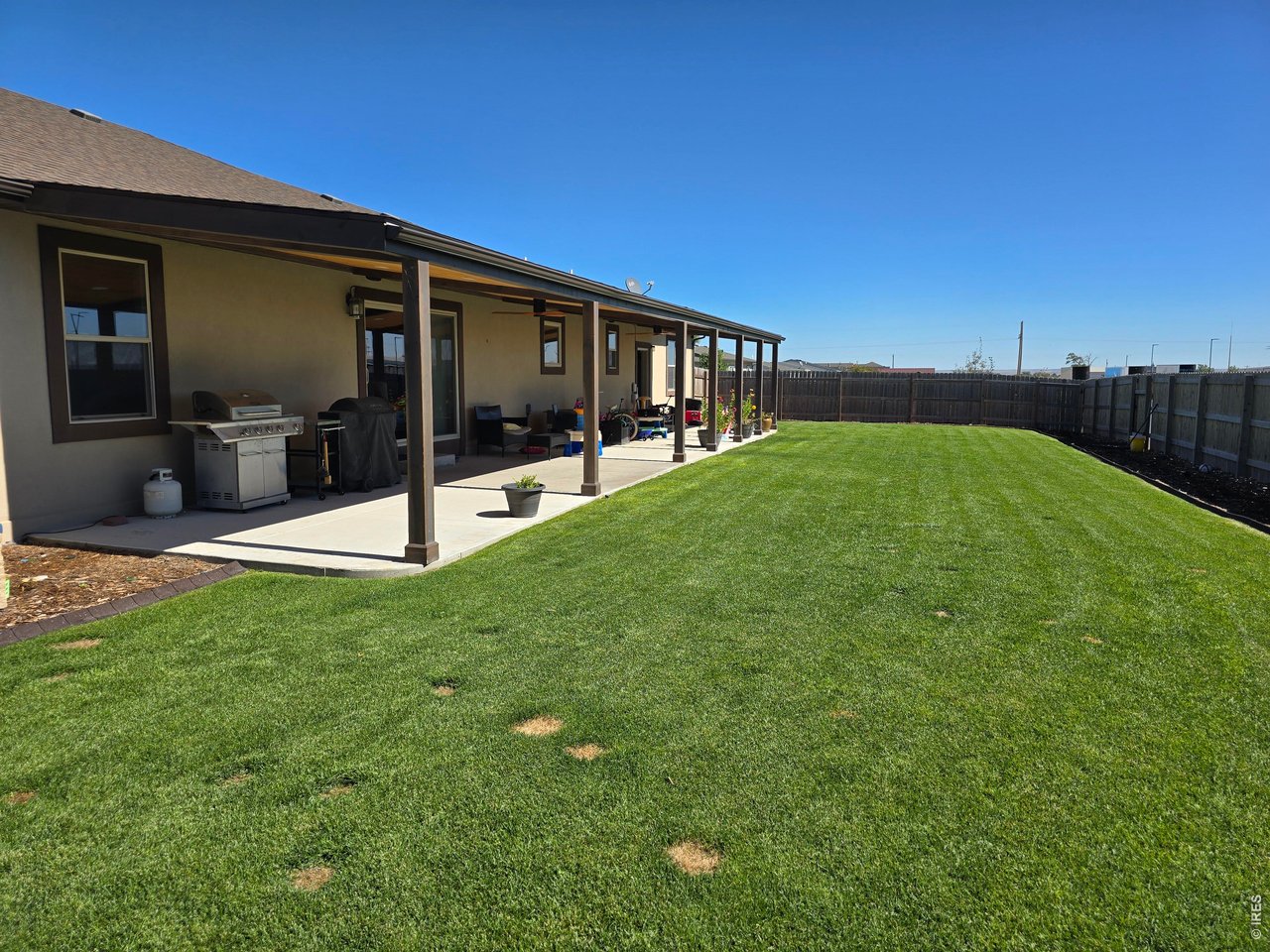 14846 Bluestem Street Sterling, CO 80751 - Photo 27 of 28 a view of a house with backyard and porch