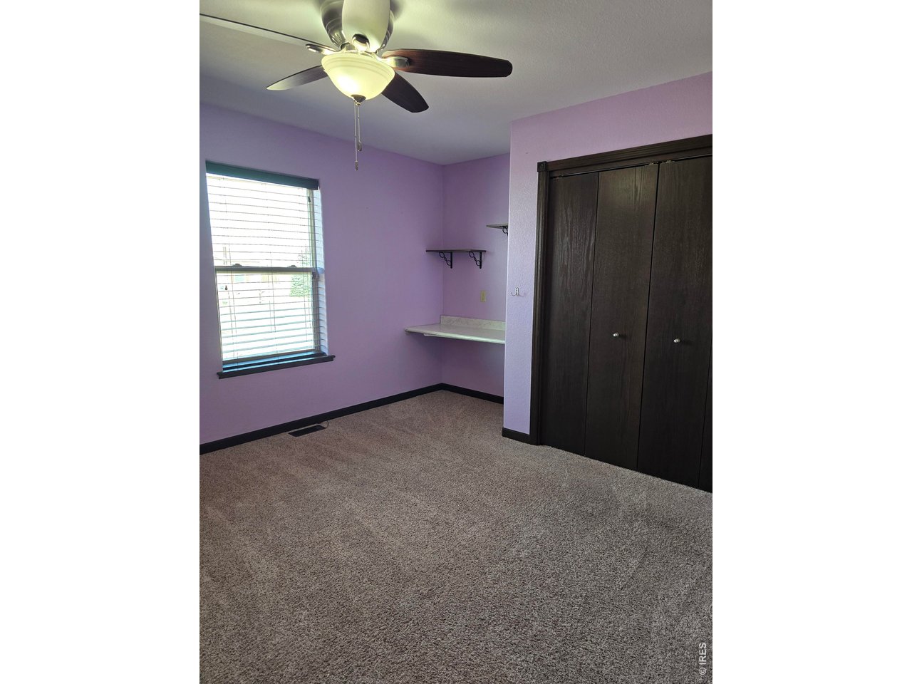14846 Bluestem Street Sterling, CO 80751 - Photo 9 of 28 a view of an empty room with a window