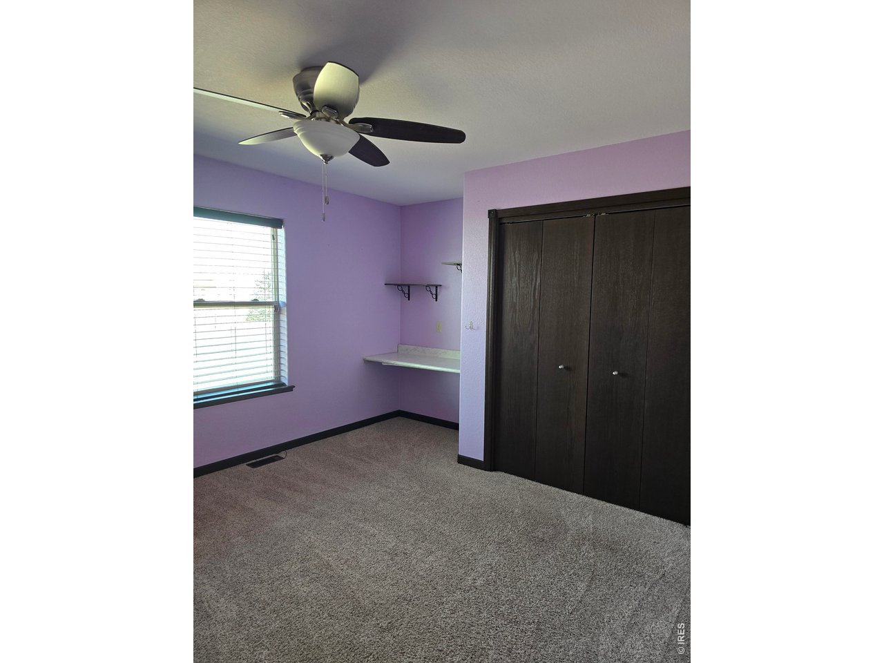 14846 Bluestem Street Sterling, CO 80751 - Photo 10 of 28 a view of an empty room with a window