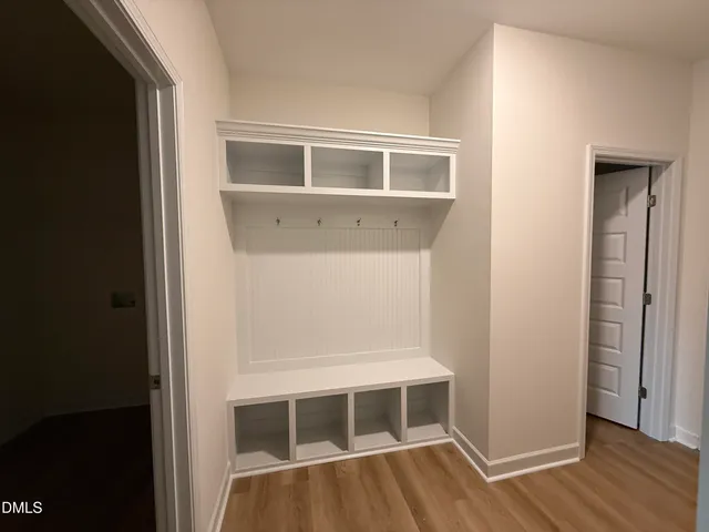 a view of wooden floor and windows in a room