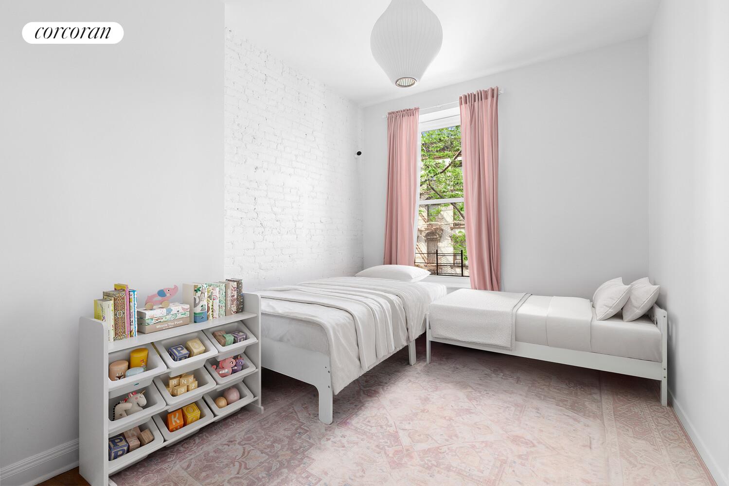 263 Clinton Street, Unit 2 Brooklyn, NY 11201 - Photo 5 of 6 a bedroom with a bed and a window