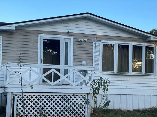 a front view of a house with chairs