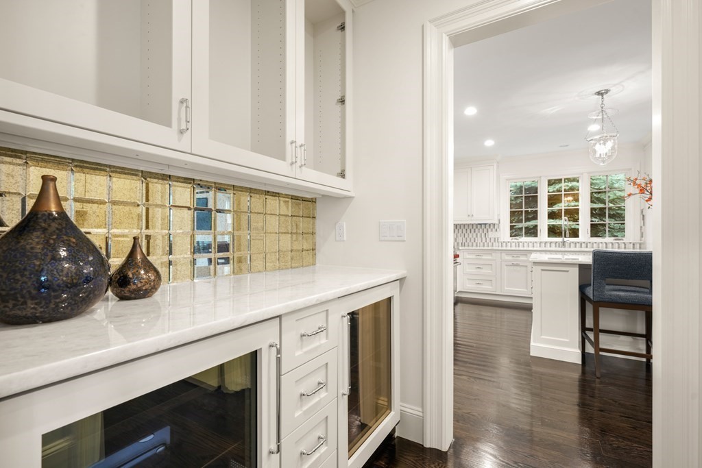29 Pine Summit Circle, Unit 29 Weston, MA 02493 - Photo 11 of 30 a kitchen with stainless steel appliances a sink and cabinets