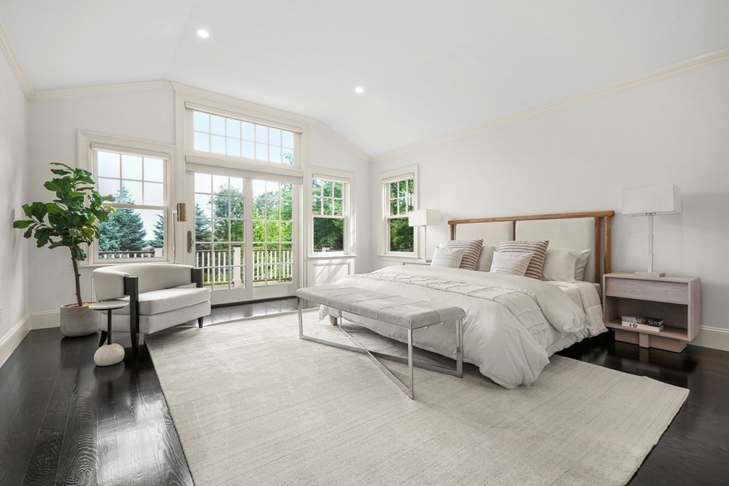 29 Pine Summit Circle, Unit 29 Weston, MA 02493 - Photo 16 of 30 a spacious bedroom with a bed and a couch next to a window