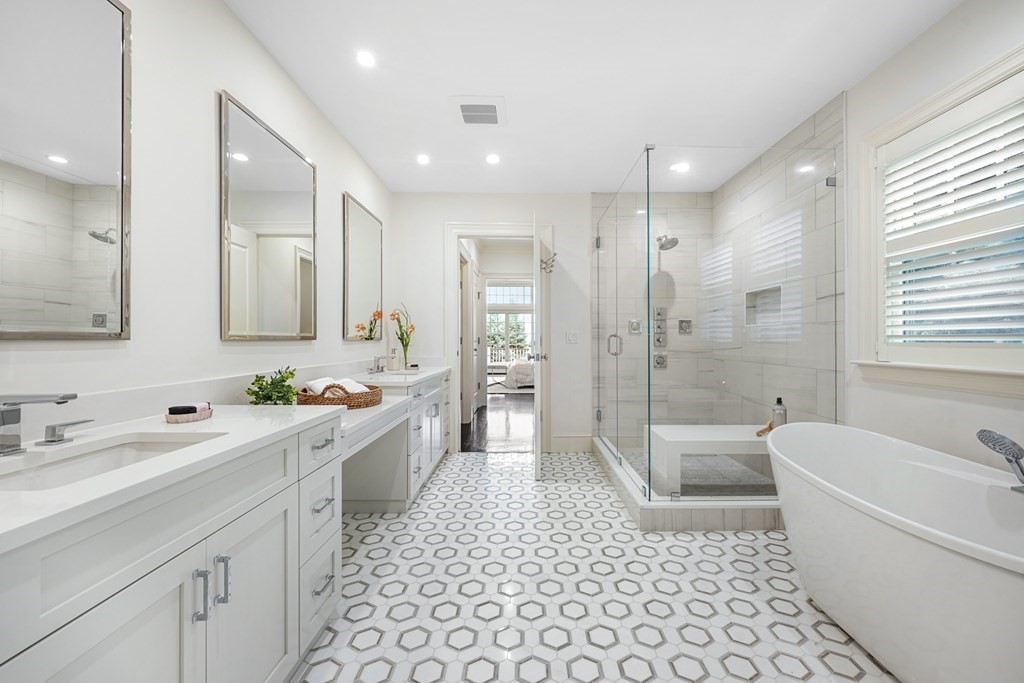 29 Pine Summit Circle, Unit 29 Weston, MA 02493 - Photo 19 of 30 a spacious bathroom with a bathtub shower sink mirror and toilet