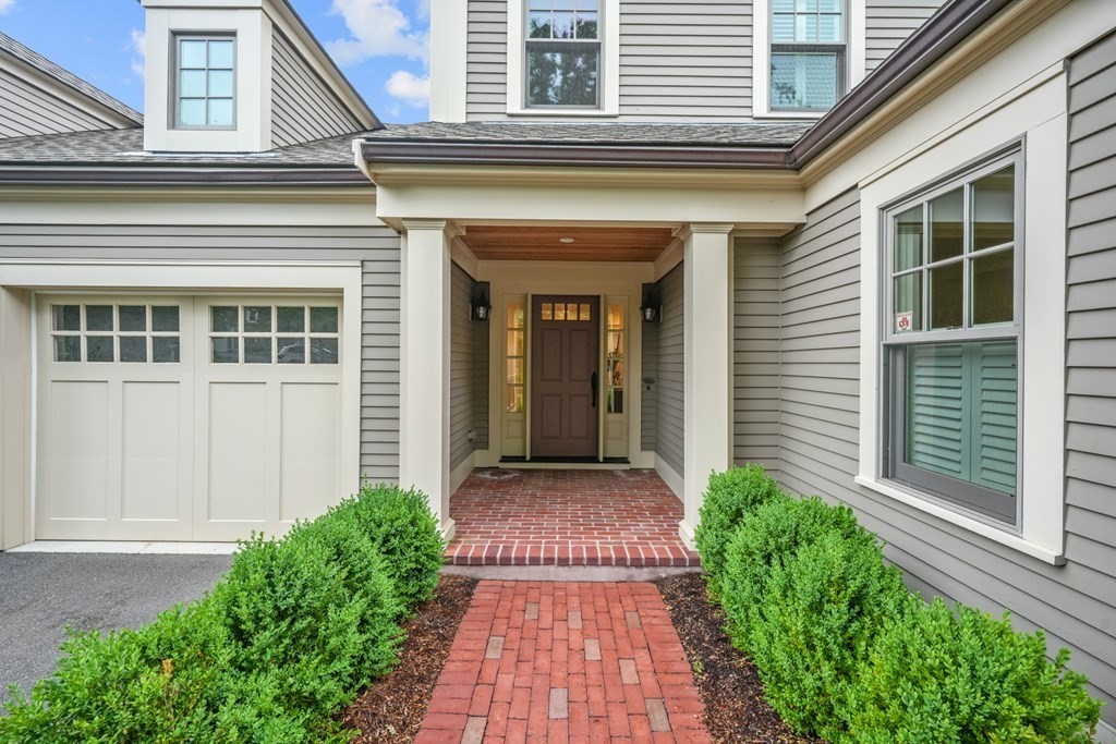 29 Pine Summit Circle, Unit 29 Weston, MA 02493 - Photo 2 of 30 a front view of a house with a yard