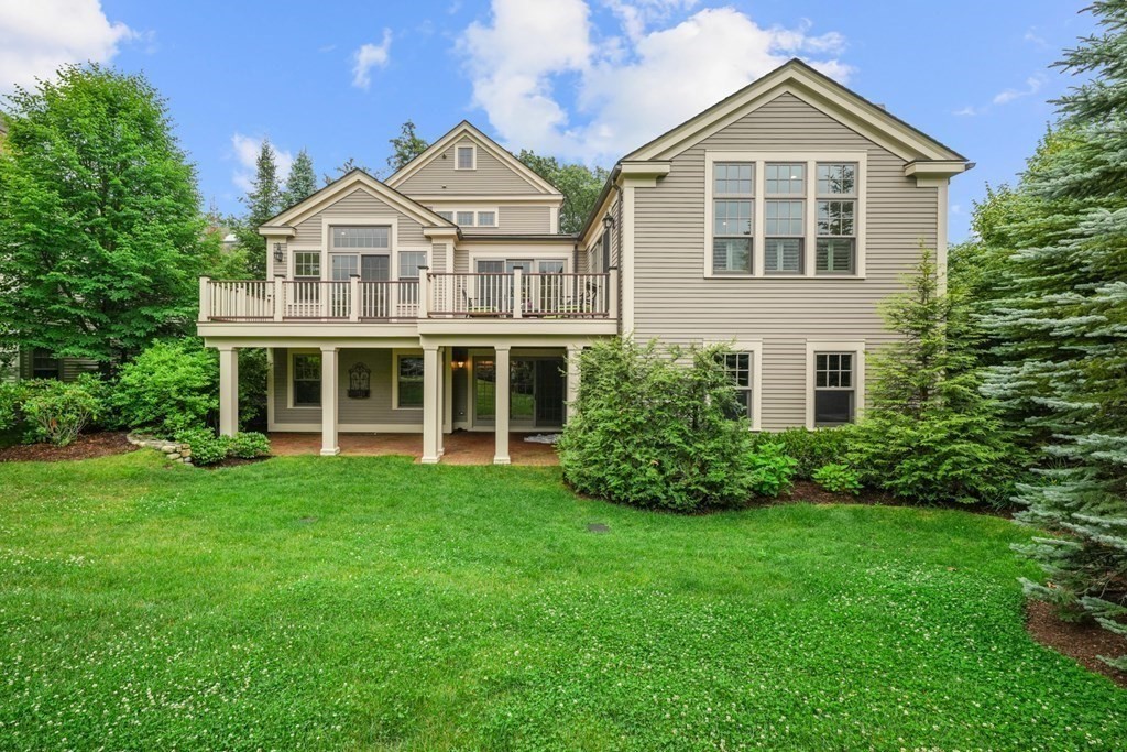 29 Pine Summit Circle, Unit 29 Weston, MA 02493 - Photo 26 of 30 a front view of a house with a yard