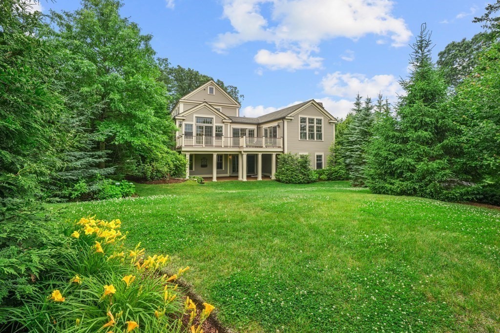 29 Pine Summit Circle, Unit 29 Weston, MA 02493 - Photo 27 of 30 a front view of a house with a garden