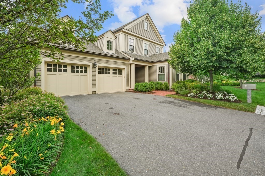 29 Pine Summit Circle, Unit 29 Weston, MA 02493 - Photo 30 of 30 a front view of a house with a garden and plants