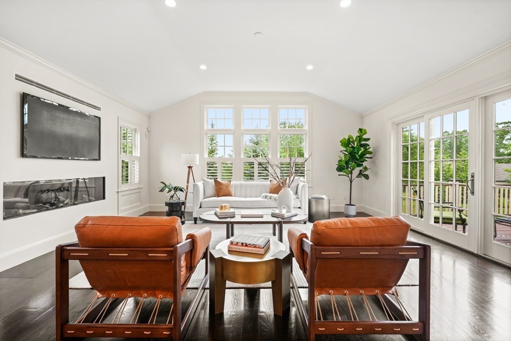 29 Pine Summit Circle, Unit 29 Weston, MA 02493 - Photo 4 of 30 a living room with furniture and a flat screen tv