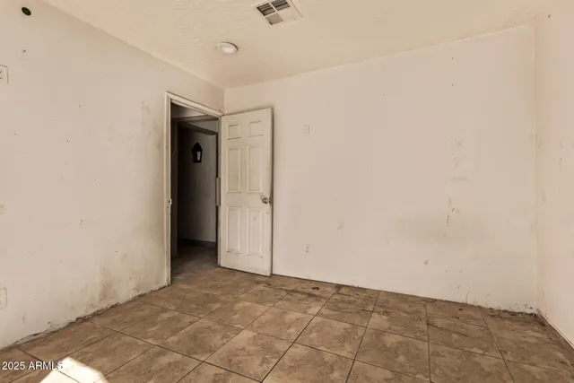 a view of a dining room with furniture and a potted plant
