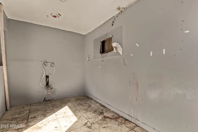 a view of a storage & utility room with a sink