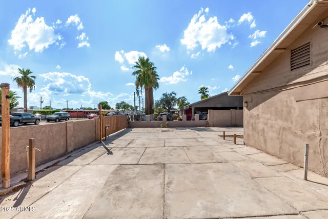 a view of outdoor space with lots of swings and slides