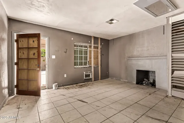 a view of livingroom with an empty space and window