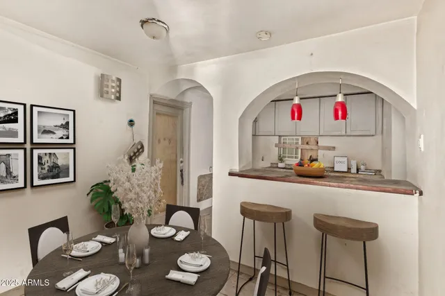 a kitchen with a table and chairs in it