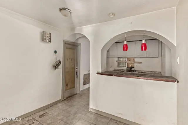 a kitchen with stainless steel appliances granite countertop a sink and a refrigerator