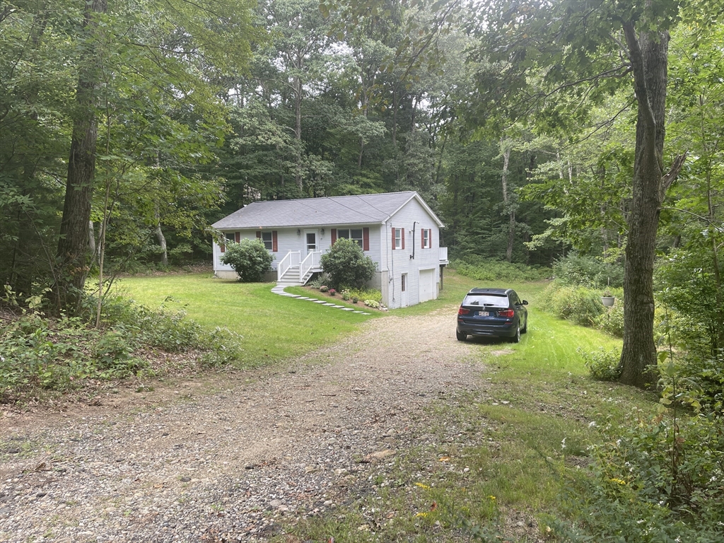 15 McBride Road Wales, MA 01081 - Photo 15 of 15 a view of a house with backyard and porch