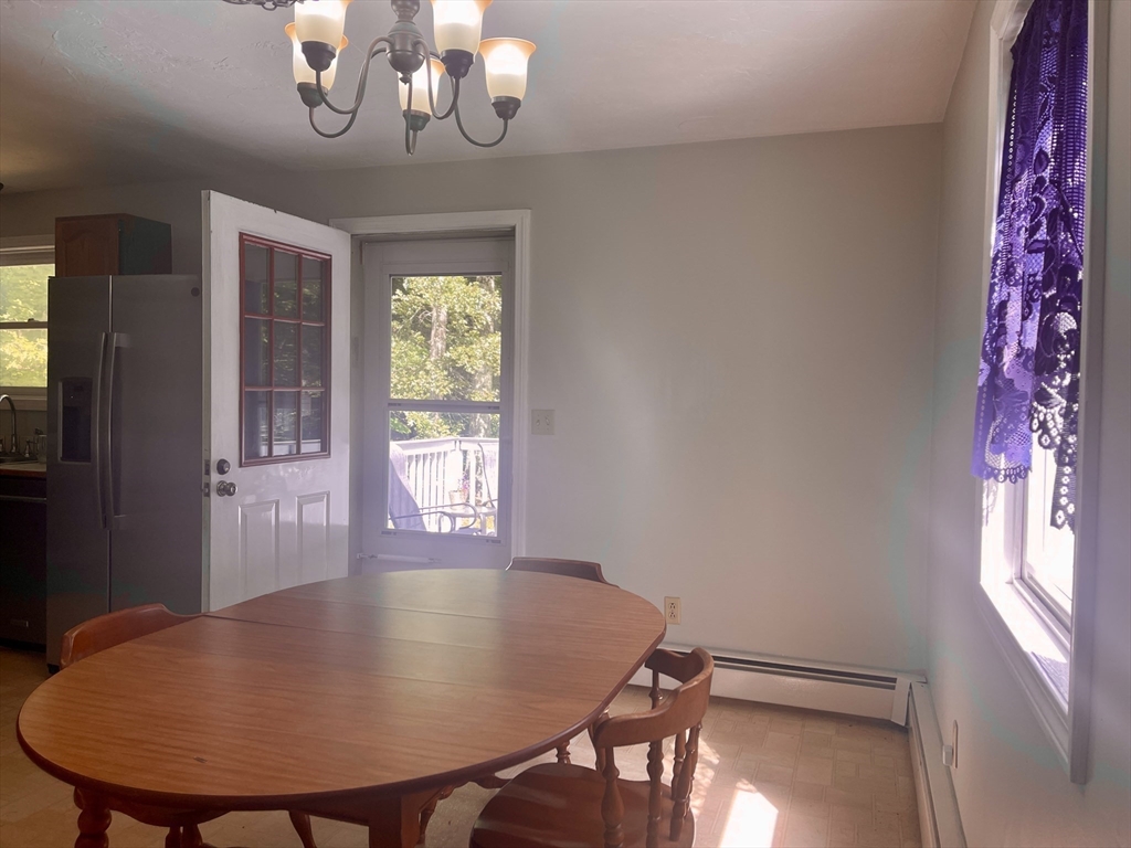 15 McBride Road Wales, MA 01081 - Photo 4 of 15 a view of a dining room with furniture window and outside view