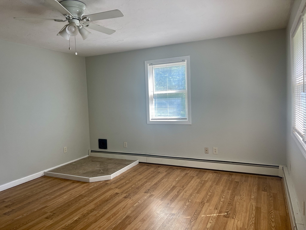 15 McBride Road Wales, MA 01081 - Photo 7 of 15 an empty room with a window and ceiling fan