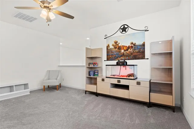 a bedroom with furniture and window