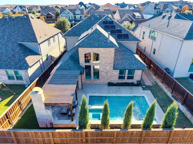 a view of a patio with table and chairs and potted plants