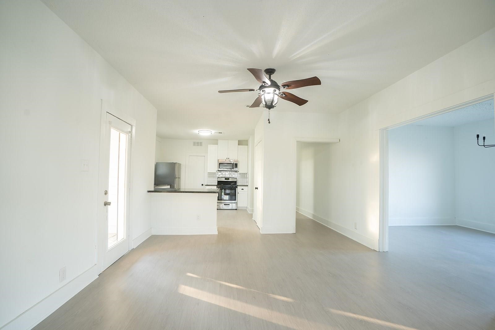 14711 Barak Road Guy, TX 77444 - Photo 5 of 8 a view of a kitchen with a sink and a refrigerator