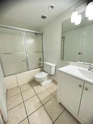 a view of a room with wooden floors and racks