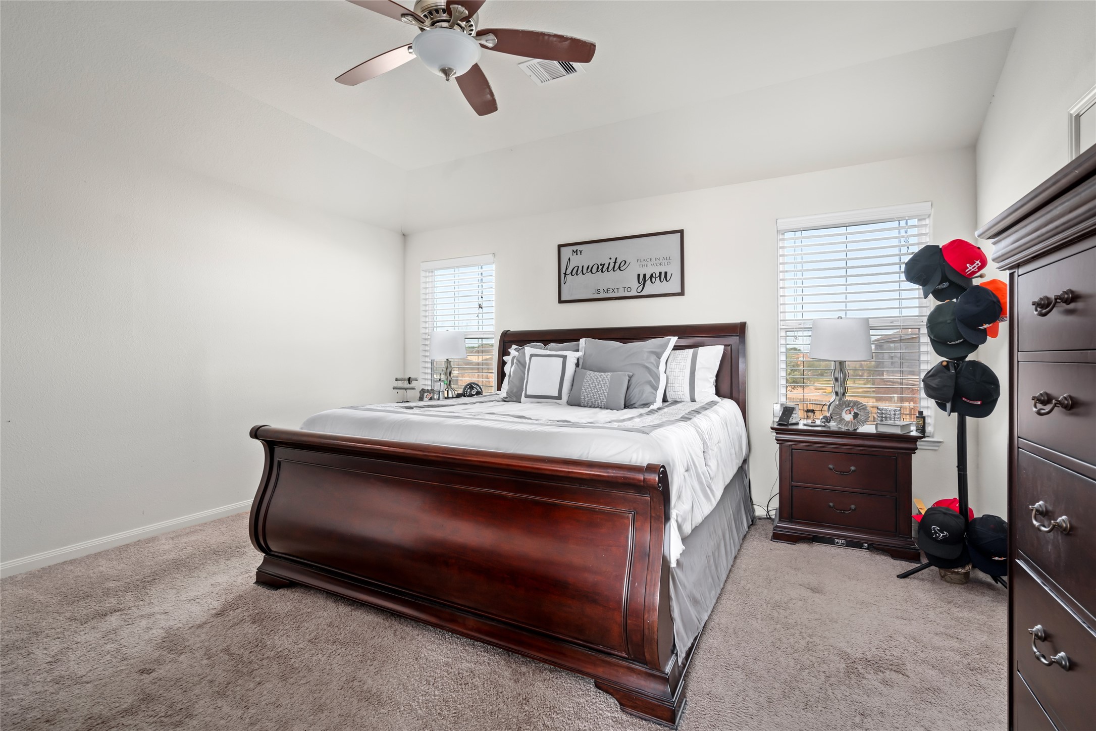 2011 Beach Bluff Road Rosenberg, TX 77469 - Photo 19 of 34
The spacious primary bedroom is a peaceful retreat, offering plenty of room to relax and unwind. With large windows that invite natural light, it features a serene atmosphere, a generous closet, and ample space for your personal touch.