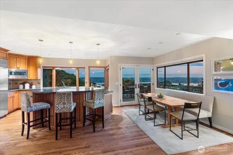 a view of a dining room with furniture window and outside view