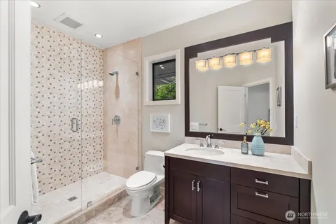 a bathroom with a shower and a toilet
