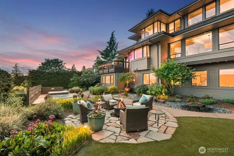 an aerial view of a house with garden space and street view