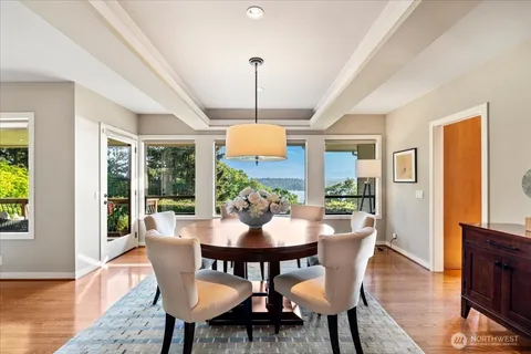 a view of a dining room with furniture window and wooden floor