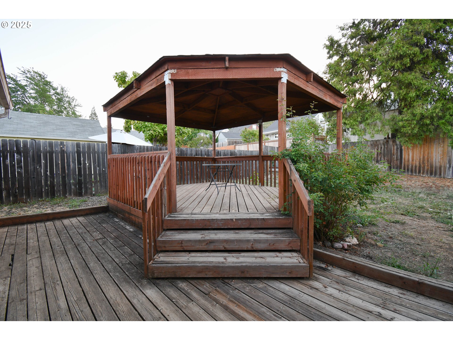1731 Southeast Hamilton Street Roseburg, OR 97470 - Photo 19 of 23 a view of backyard with wooden deck and outdoor seating