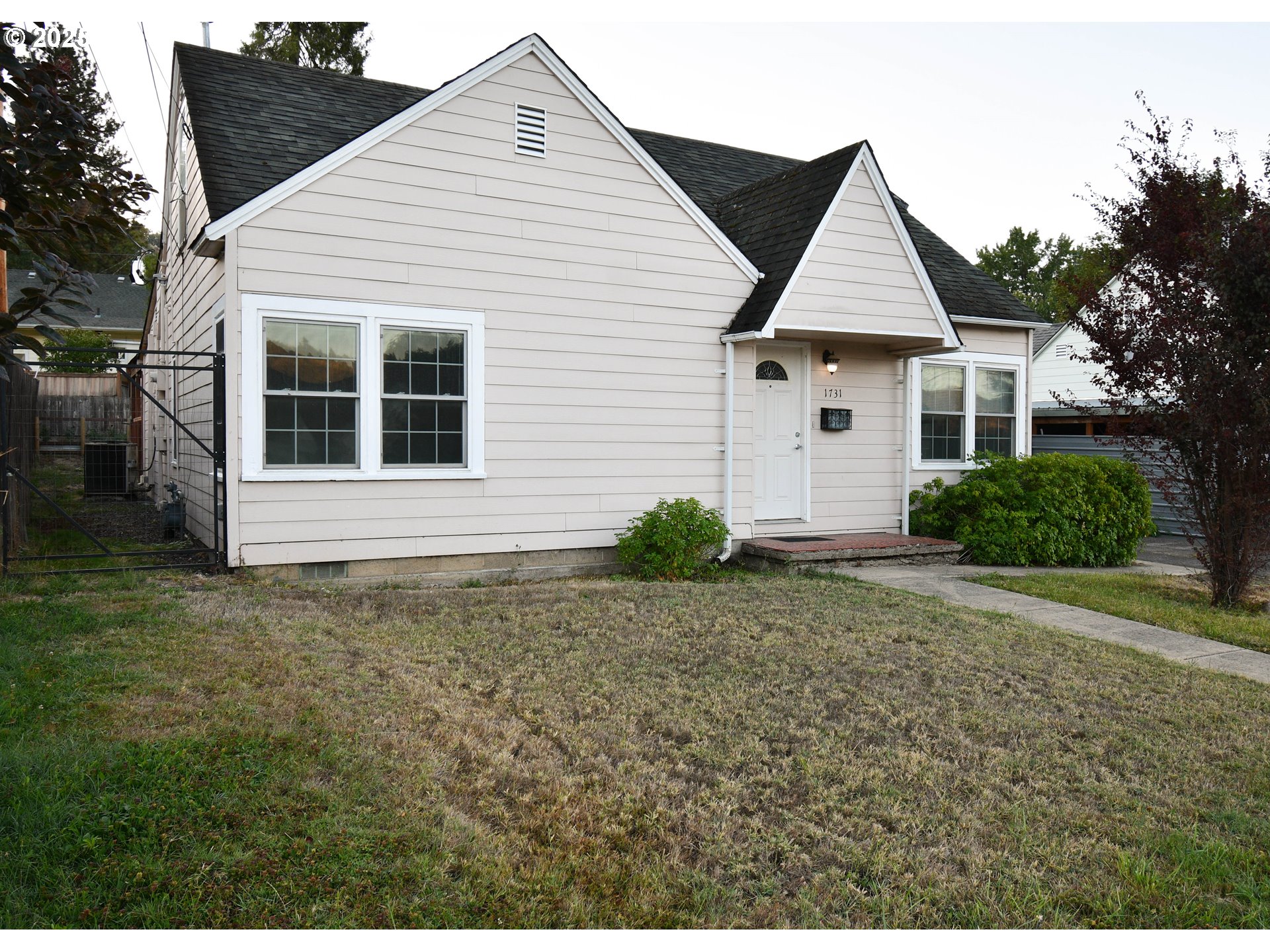 1731 Southeast Hamilton Street Roseburg, OR 97470 - Photo 2 of 23 a view of front a house and yard