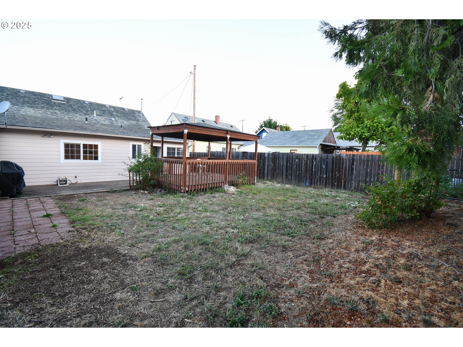1731 Southeast Hamilton Street Roseburg, OR 97470 - Photo 22 of 23 a backyard of a house with lots of green space