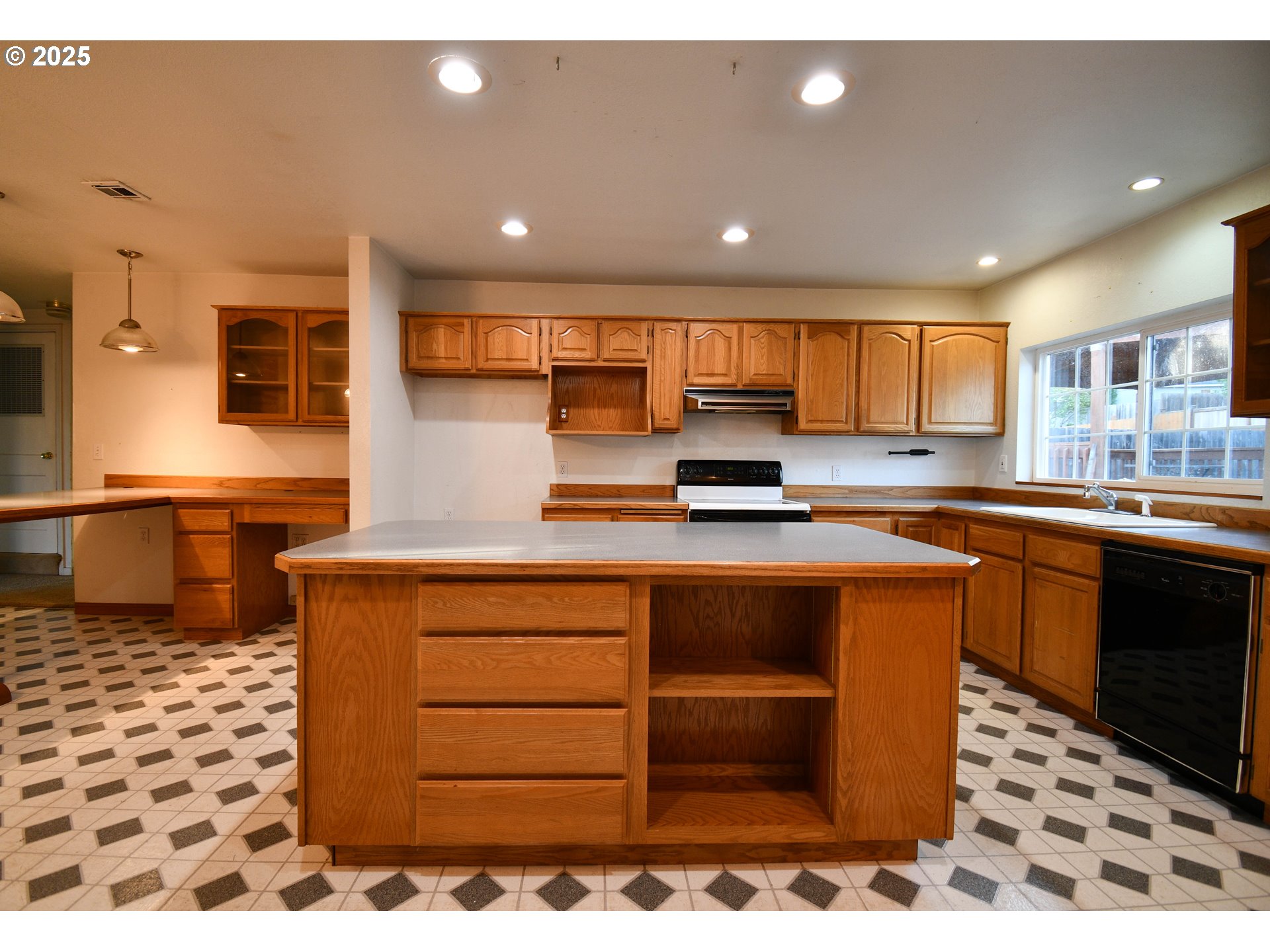 1731 Southeast Hamilton Street Roseburg, OR 97470 - Photo 7 of 23 a kitchen with stainless steel appliances kitchen island granite countertop a sink and cabinets