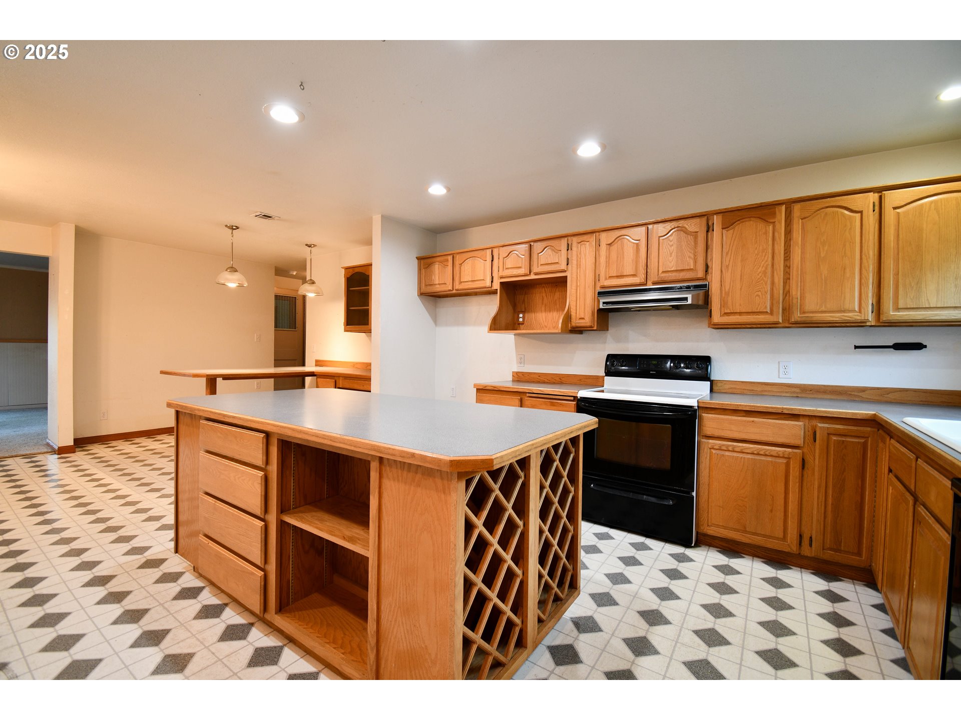 1731 Southeast Hamilton Street Roseburg, OR 97470 - Photo 8 of 23 a kitchen with stainless steel appliances kitchen island granite countertop a sink and a stove