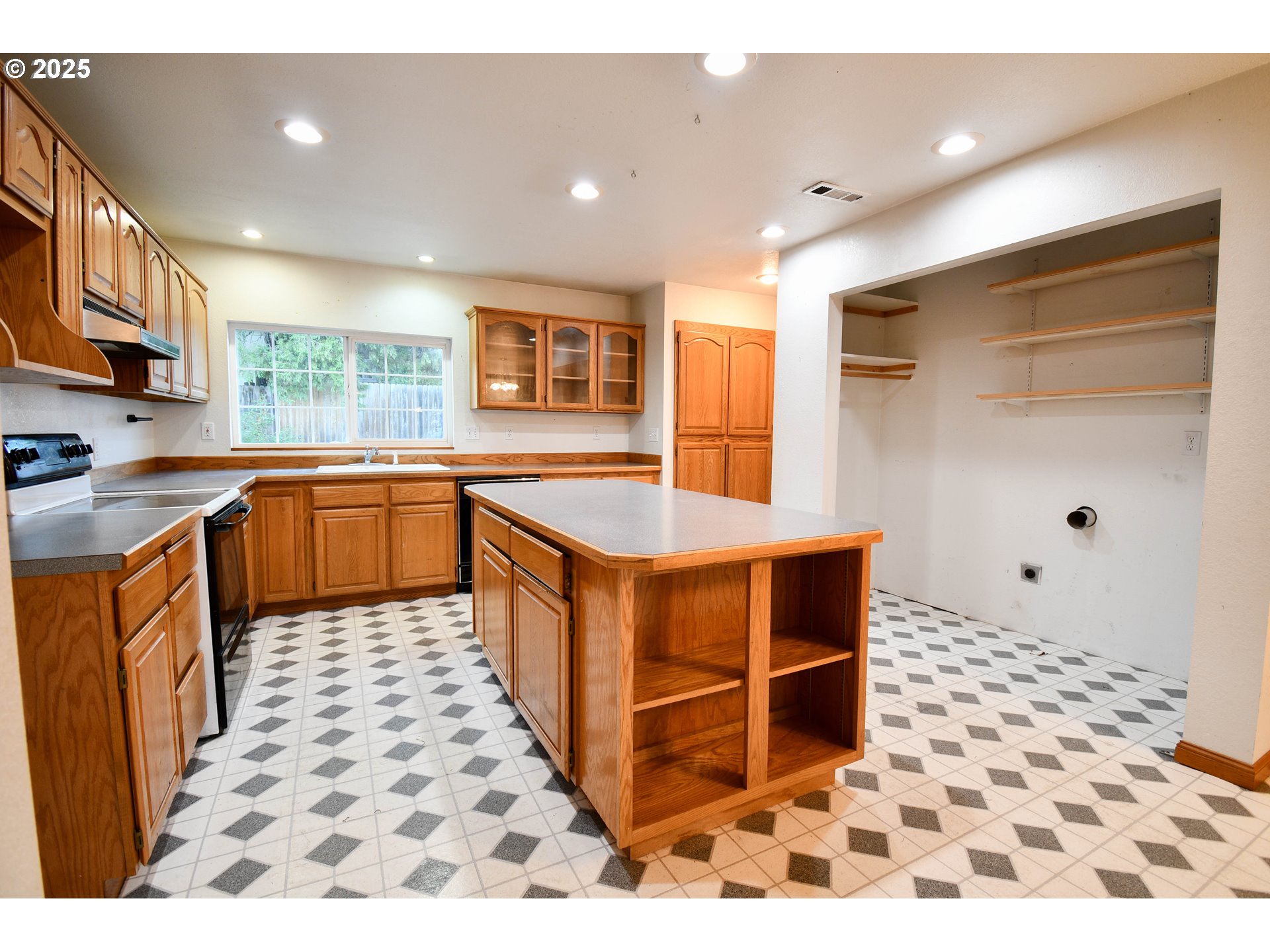 1731 Southeast Hamilton Street Roseburg, OR 97470 - Photo 9 of 23 a kitchen with stainless steel appliances granite countertop a sink and cabinets