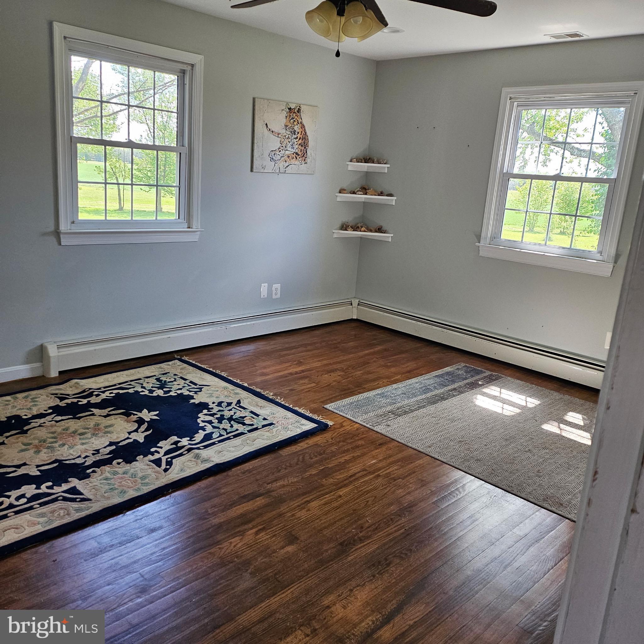 9348 Bastable Mill Road Catlett, VA 20119 - Photo 13 of 20 a view of a livingroom with wooden floor and window