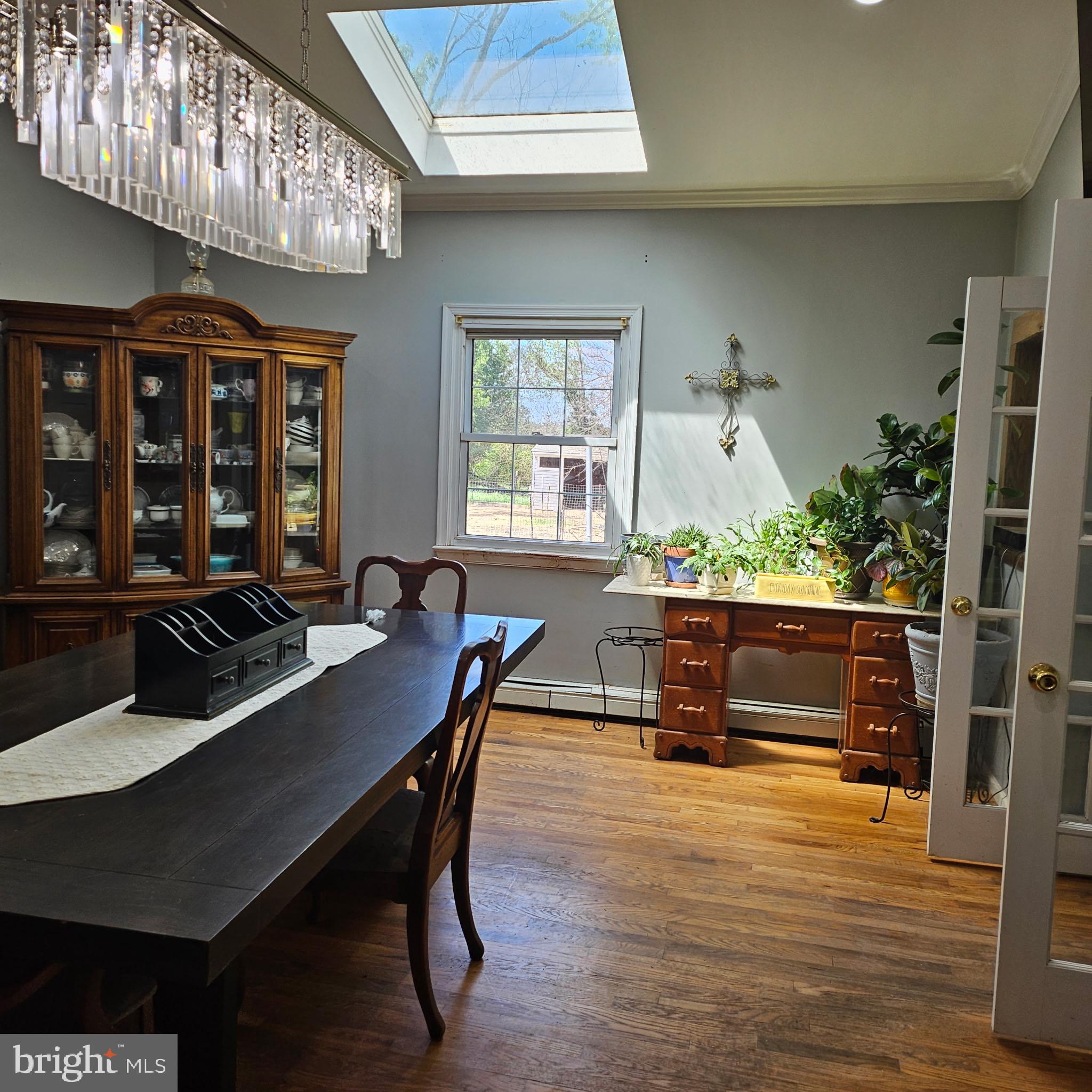 9348 Bastable Mill Road Catlett, VA 20119 - Photo 15 of 20 a view of a dining room with furniture window and wooden floor