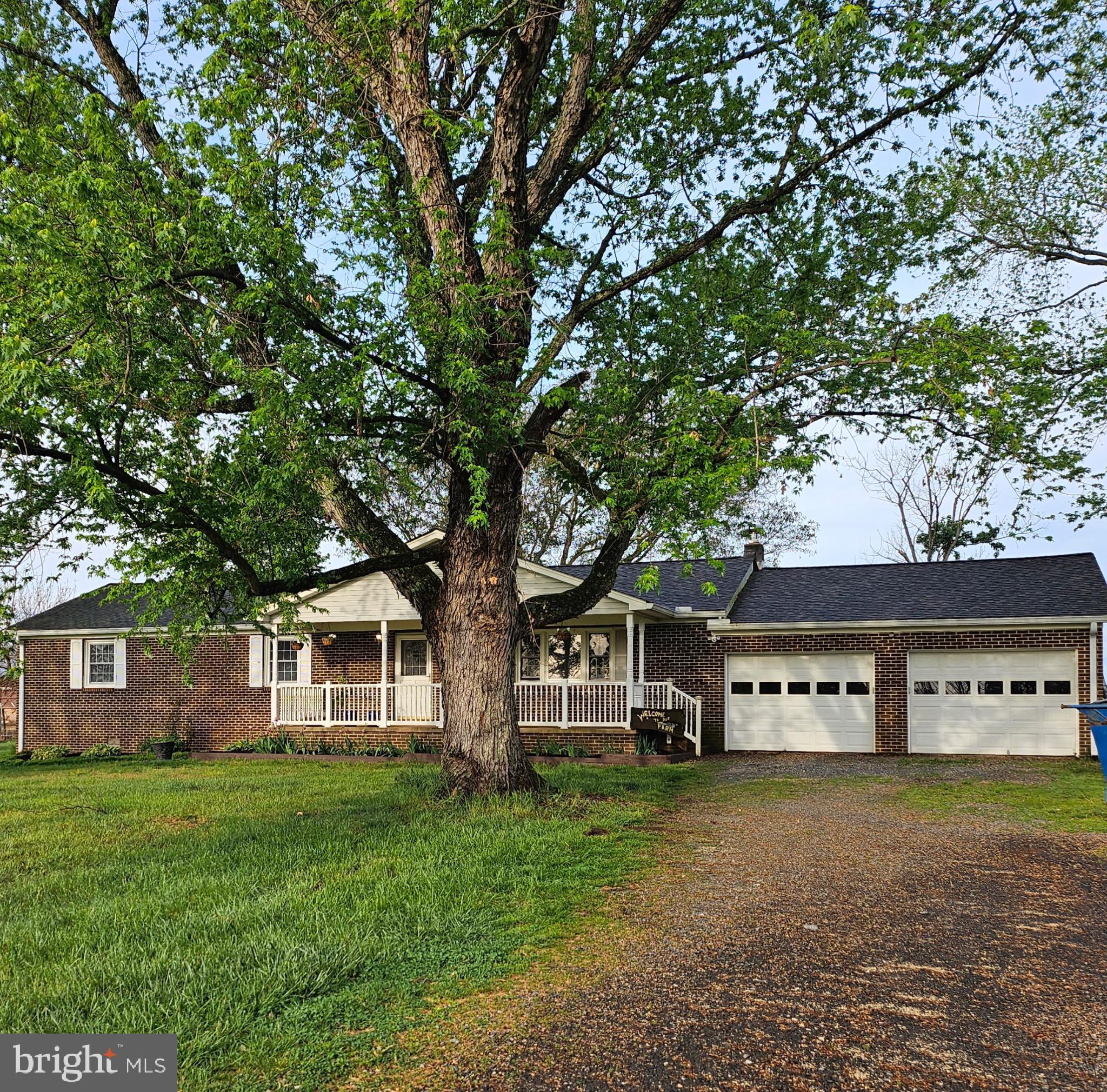 9348 Bastable Mill Road Catlett, VA 20119 - Photo 18 of 20 a view of a house with a yard and large tree
