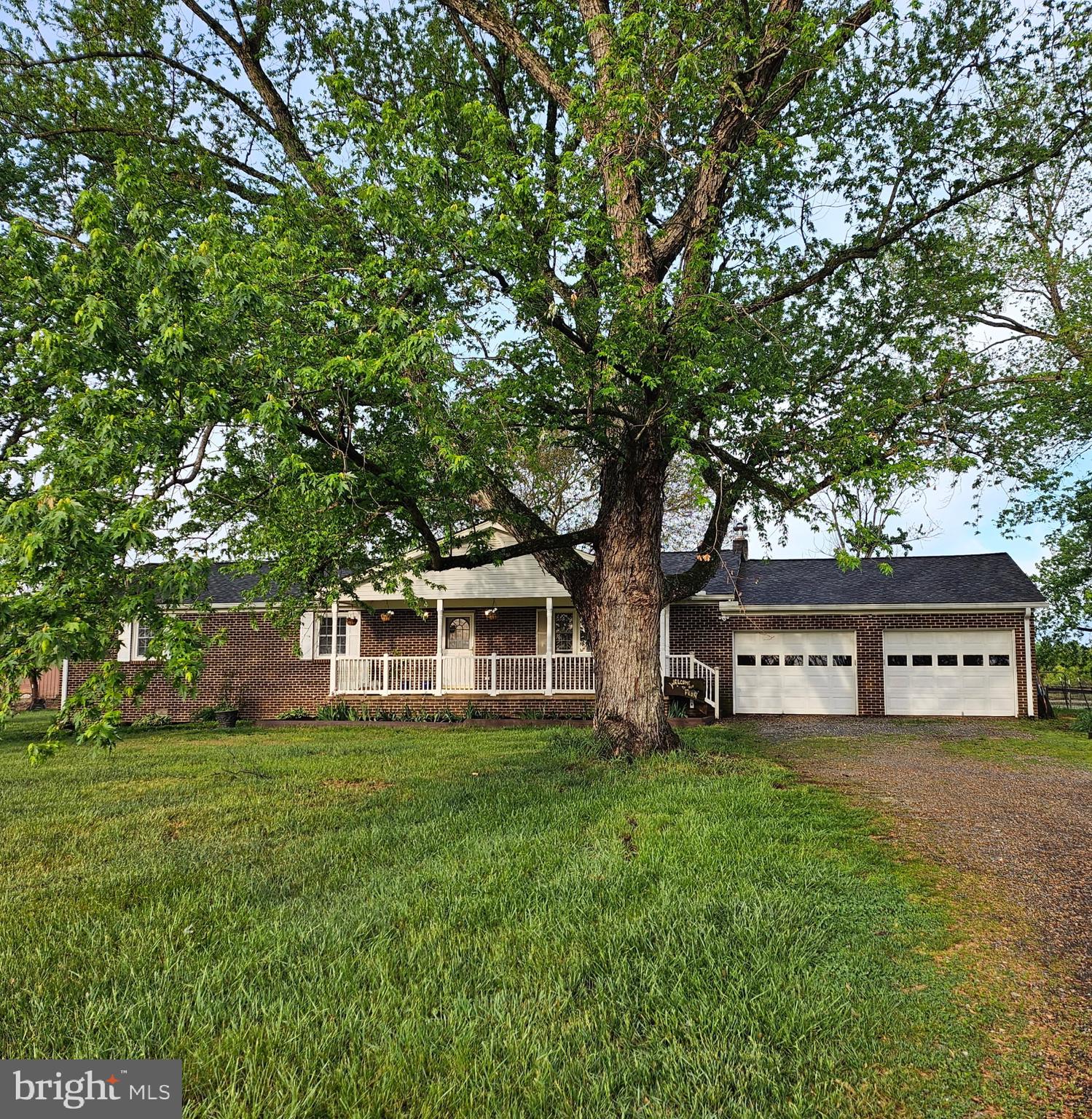9348 Bastable Mill Road Catlett, VA 20119 - Photo 19 of 20 a view of a house with a big yard and large trees