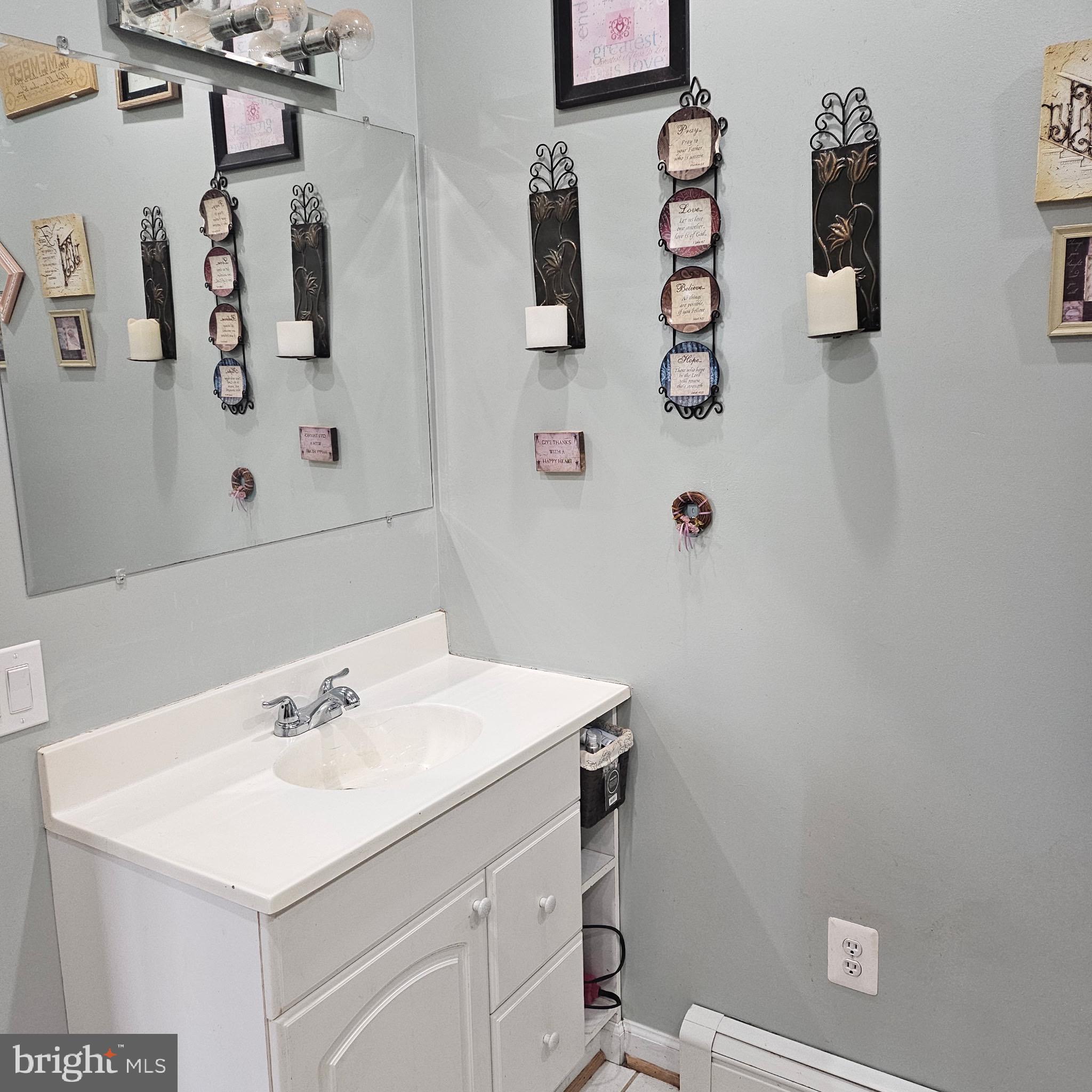 9348 Bastable Mill Road Catlett, VA 20119 - Photo 6 of 20 a bathroom with a sink and mirror