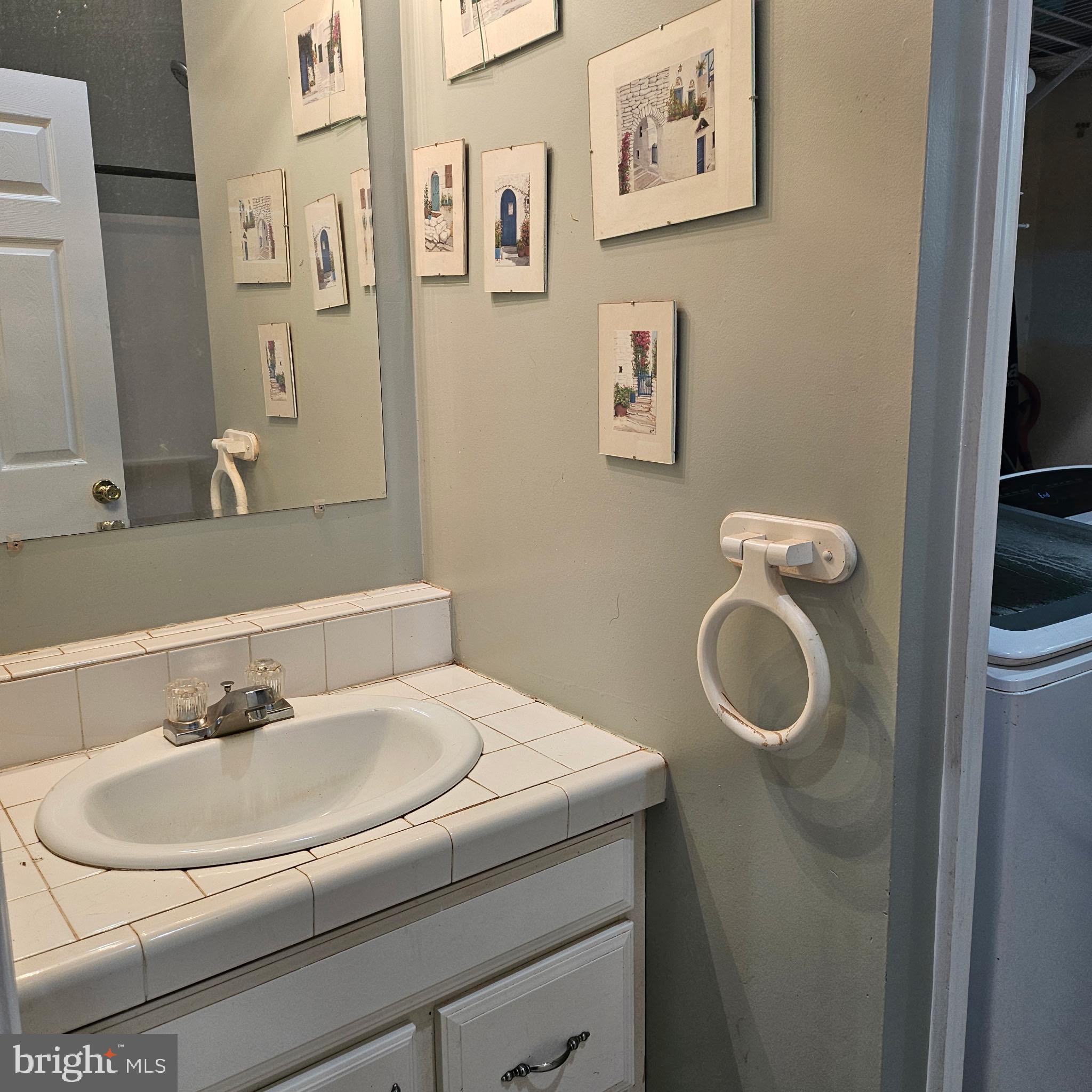 9348 Bastable Mill Road Catlett, VA 20119 - Photo 9 of 20 a bathroom with a sink and a mirror